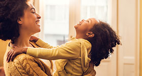 Mother and daughter laughing