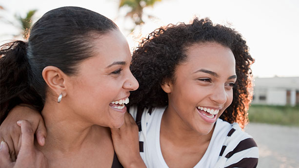 523328872- mother and daughter laughing